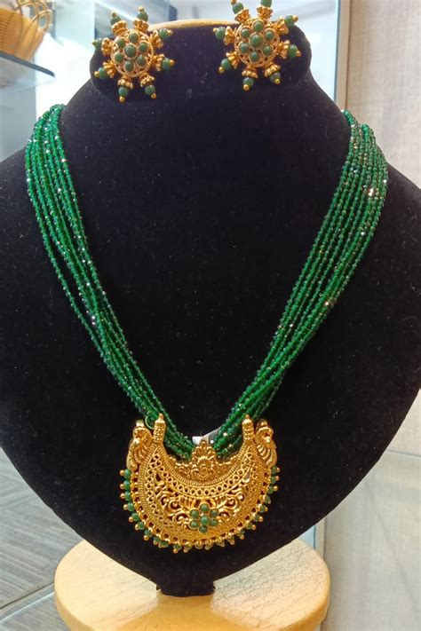 Gold Plated coorgi Pendant set with green crystal chain – Griiham