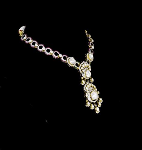 Elegant fusion-style necklace and earring pair featuring uncut diamond ...
