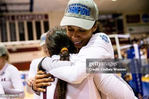 Kayla Elliott of the West Texas A&M Buffs hugs a teammate while... News ...