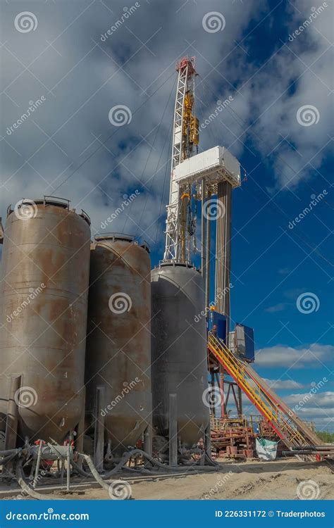 A Drilling Rig with Cementing Equipment in an Oil and Gas Field Stock ...