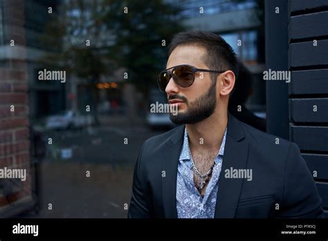 Man in a Business Suit in a Mall Parking Lot 的图像结果