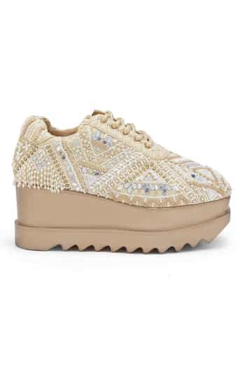 Buy Off White Jashn Embellished Wedge Sneakers by Anaar Online at Aza ...