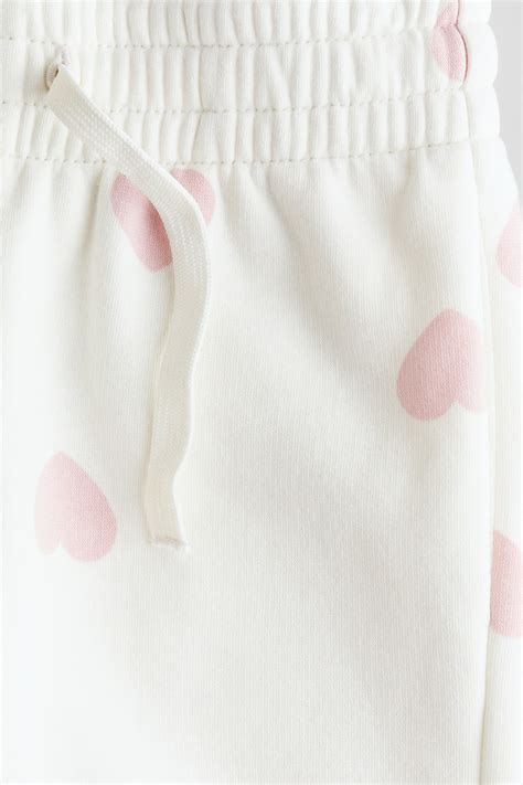 White/Hearts Brushed-inside joggers for kids | H&M IN