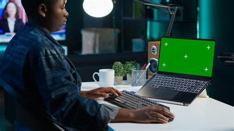 Teleworking woman in living room office using chroma key laptop ...