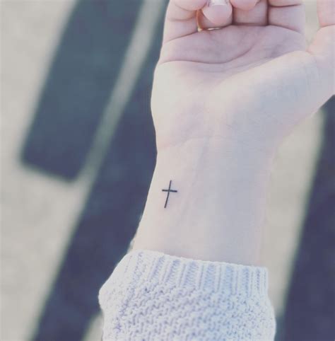 Cross tattoo on wrist | Cross tattoo on wrist, Small cross tattoos ...
