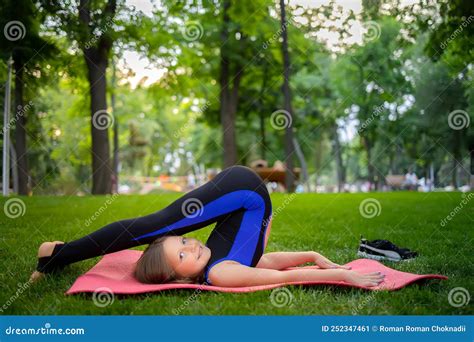 Girl Performs Inverted Yoga Asanas Outdoors, Candle Pose Royalty-Free ...