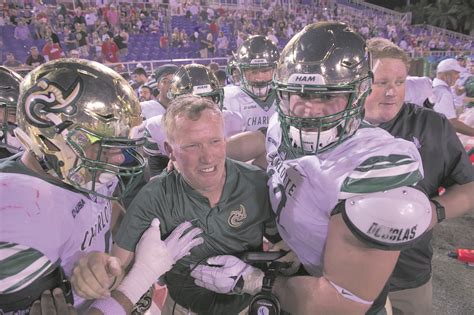 charlotte athletics charlotte players celebrate with former coach brad ...