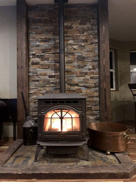 Pellet stove rock wall with reclaimed beams in 2024 | Wood stove ...