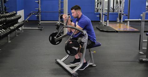 Image result for Bicep Curl Machine Exercise