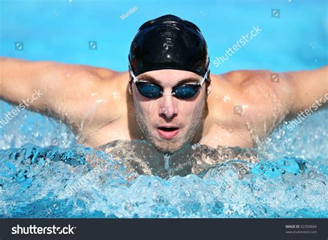 Swimmer. Man Swimming Butterfly Strokes In Competition. Competitive ...