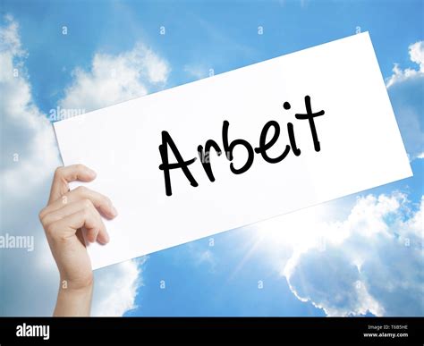 Arbeit (Work in German) Sign on white paper. Man Hand Holding Paper ...
