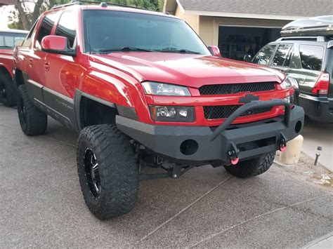Red Chevrolet Avalanche 2500