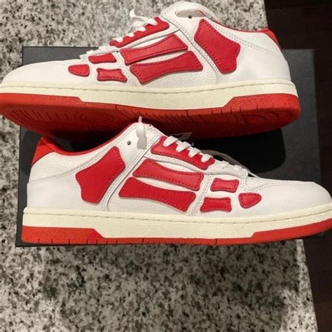 Low top red and white Amiri sneakers Men size 8.5 ... - Depop
