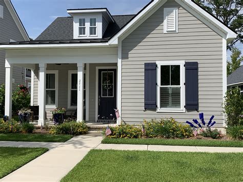 Gray House with Blue Shutters and White Trim