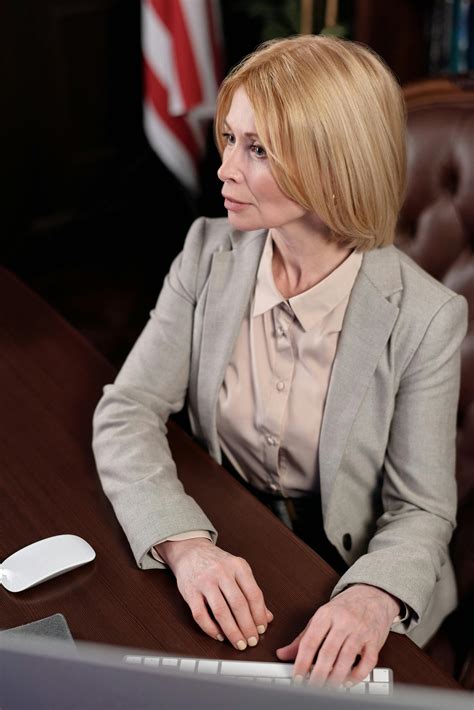 Businesswoman Sitting in Office Stock 的图像结果