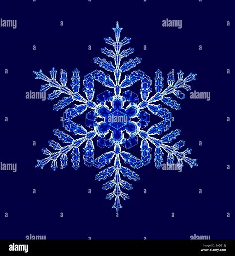 Snowflake. Light micrograph of a fernlike stellar dendrite snowflake. Snowflakes are symmetrical ...