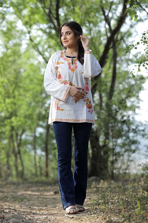White cotton aari work kurti with multicoloured designer flower