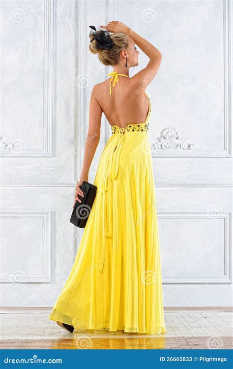 Beautiful Woman in a Long Yellow Dress. Stock Image - Image of ...