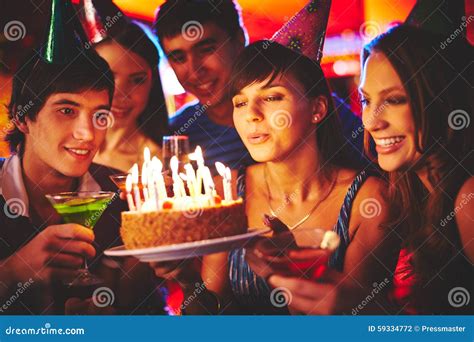 Blowing on Candles in the Dark Stock Photo - Image of joyful, festive ...
