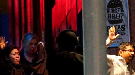 Police storm Sydney cafe to end hostage siege, three dead including gunman