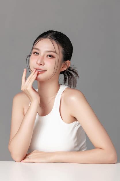 Young woman with playful expression in a chic studio setting | Premium ...