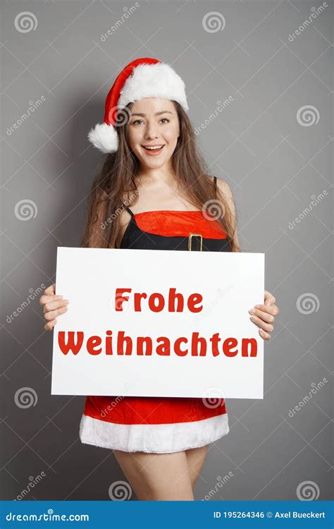 Frohe Weihnachten - Female Santa Wishes Merry Christmas in German Stock ...