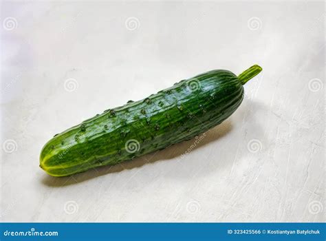 Cucumber Sitting on White Surface with Water Droplets on it. Generative ...