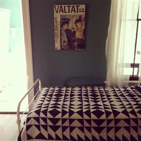 Black and White Bedspread on Bed Next to Window