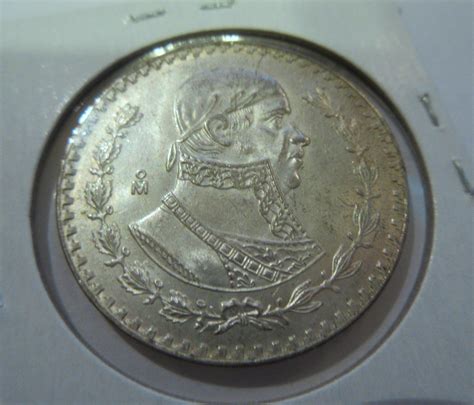 Sold Price: 1958 Mexico Un Peso Silver - November 5, 0122 6:00 PM CDT