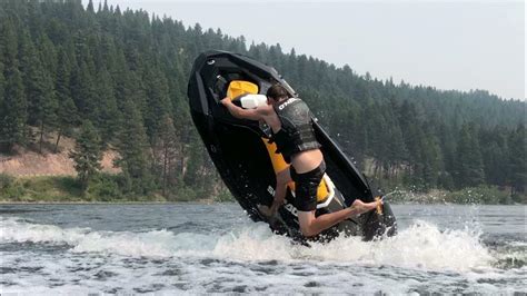 A woman performing a stunt on her Sea-Doo Spark with the words “Make Waves sales event”