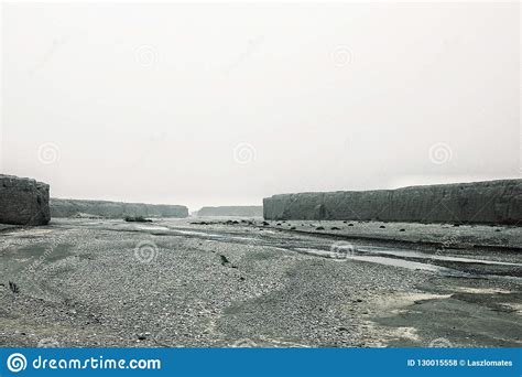 River Valley with High Rock Cliffs in a Desert Landscape Stock Photo ...