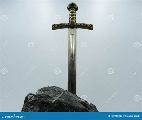 Excalibur the Mythical Sword in the Stone of King Arthur Stock Image ...