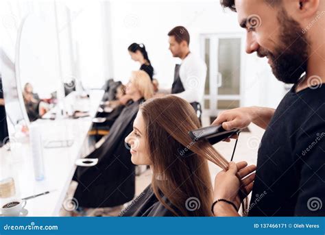 Female Hairdresser Straighten Brown Hair To Pretty Woman Using Hair ...