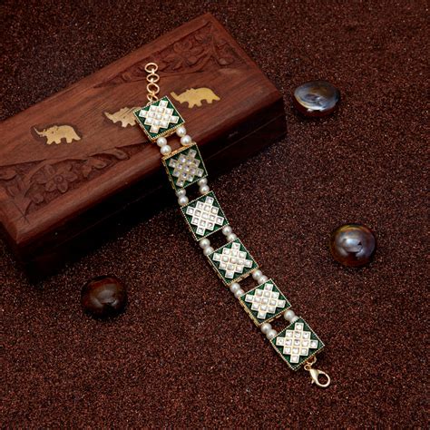 Sukkhi Sparkling Pearl Gold Plated Meenakari Bracelet Worn By Karisma ...