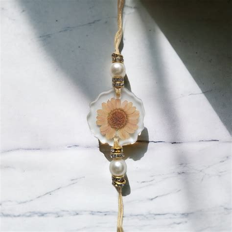 Peach Harmony Rakhi – Real Flower Rakhi for Brother – Elnorah