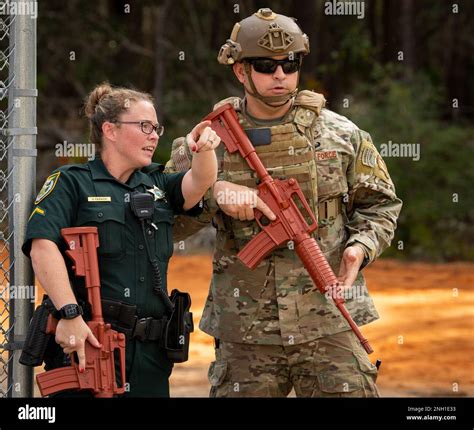Field Training Officer Sarah Warwick, Walton County Sheriff’s Department, briefs a 96th Security ...
