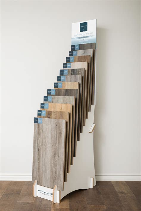 wooden slotted flooring display rack waterfall view display showroom ...