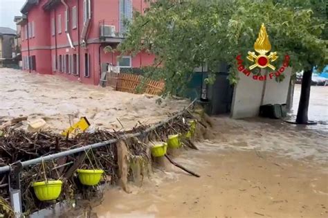 Italy floods: Storms drown holiday hotspots as people trapped in cars ...