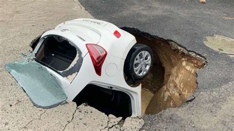 Photos: In Delhi, road gobbles up car | The Times of India