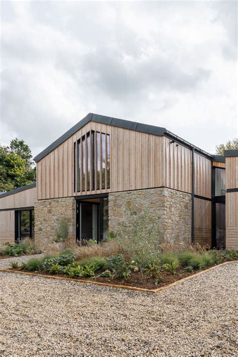 Class Q barn conversion, timber cladding above local stone walls, standing seam zinc roofs ...
