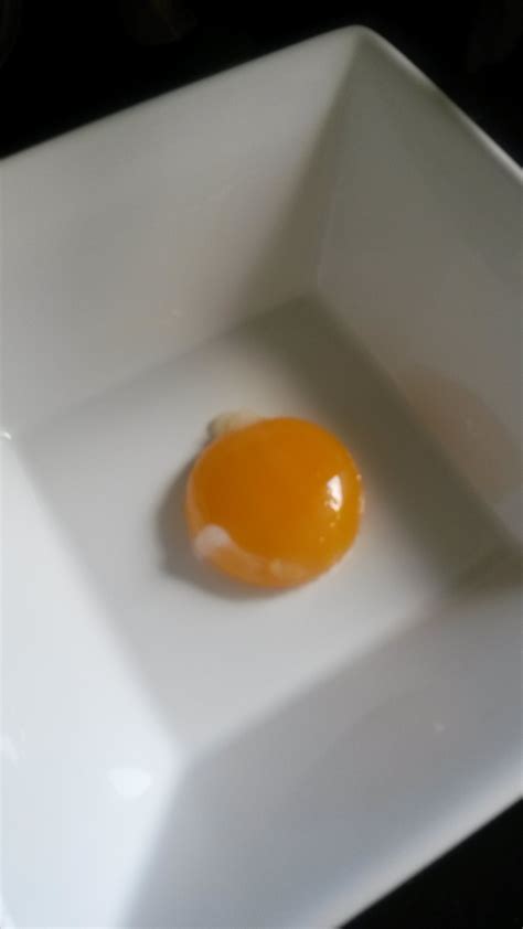 Slow cooked confit hen’s egg yolk with truffle cheese vinaigrette ...