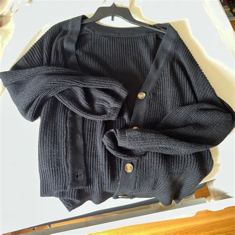 Oversized black cardigan with brown buttons, never... - Depop