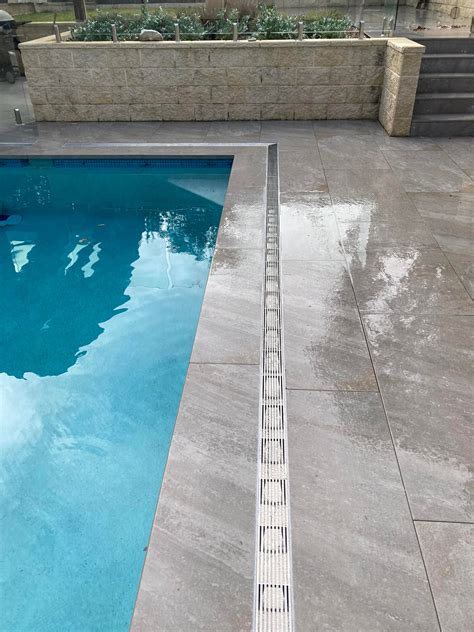 Custom pool overflow drainage completed for a happy customer. | SAS ...