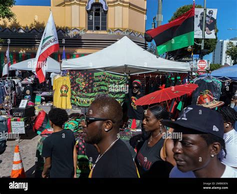 People attend a Juneteenth commemoration at Leimert Park in Los Angeles ...