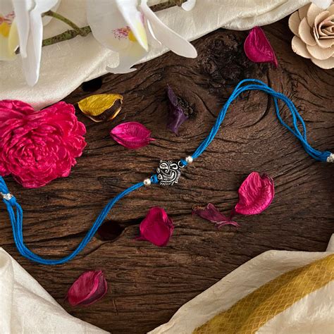 Rakshabandhan Silver Ganpati Rakhi-Blue-G13041 – vrikshamindia