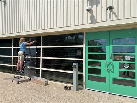 Bird strike prevention film being installed at Minnesota Valley ...