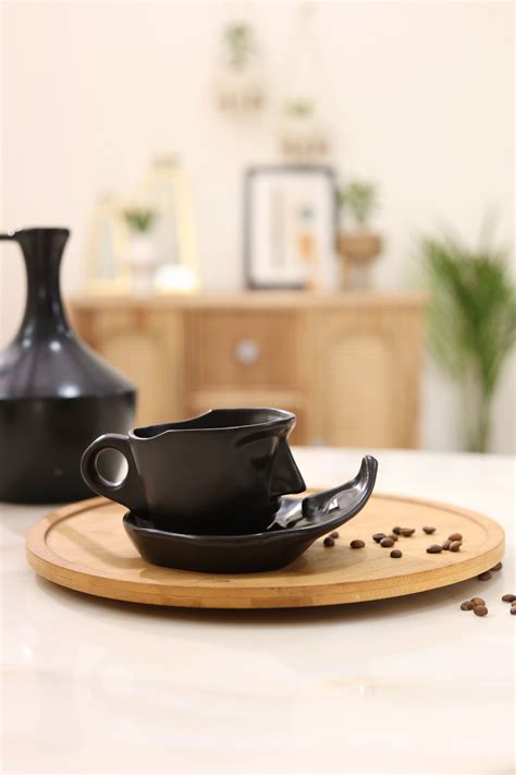 Abstract Face Cup and Saucer- Black – Craftribal