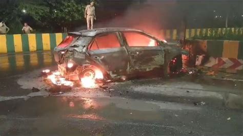Noida: Car goes up in flames after crashing into divider, 2 injured ...