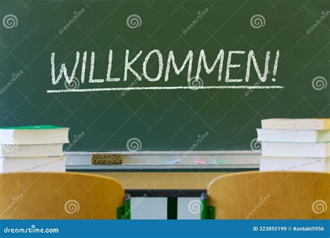 Chalkboard in the Classroom with German Chalk Writing "Willkommen ...