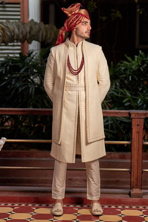 Cream sherwani in lucknowi with sequence and resham work
